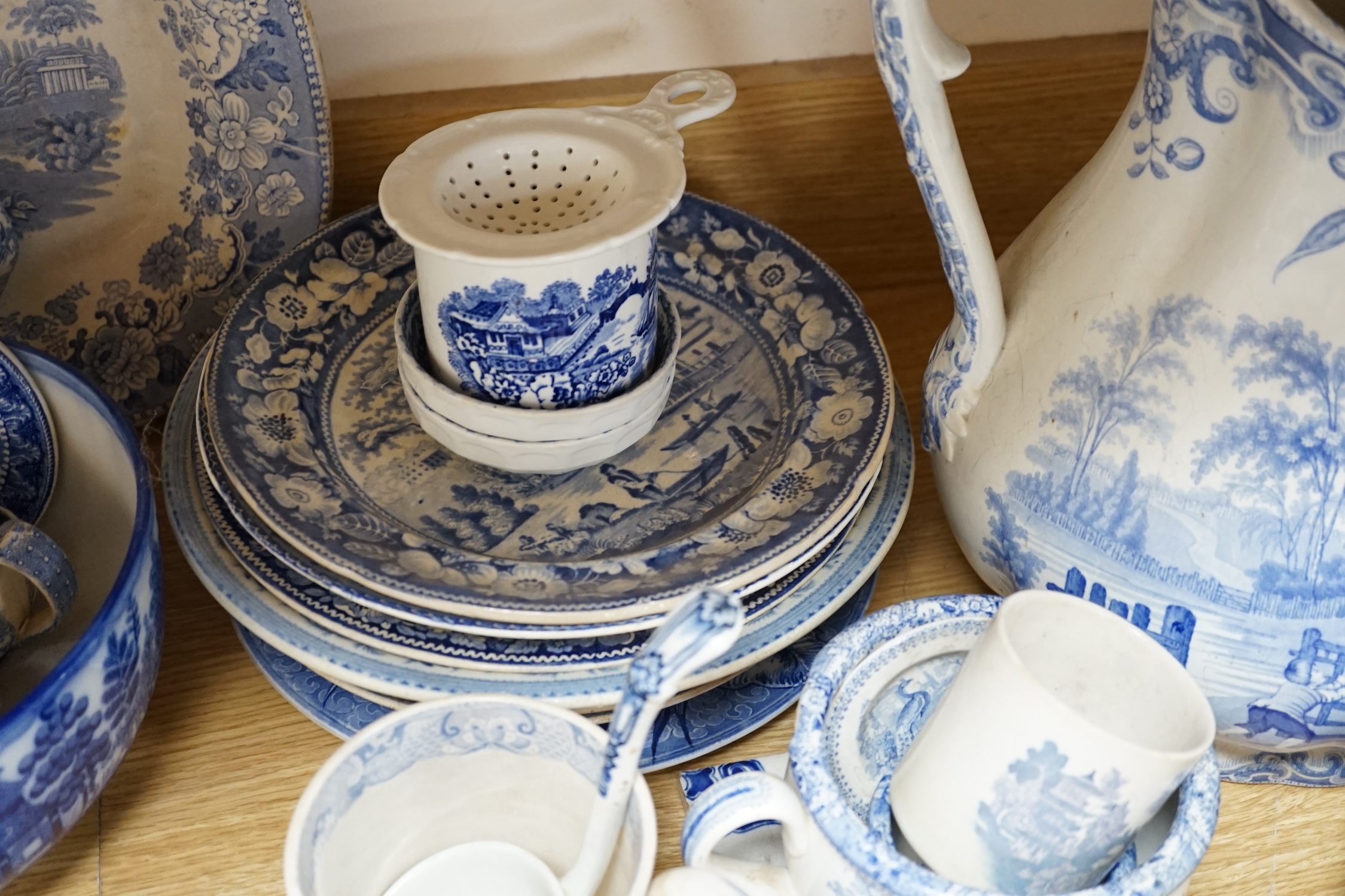 A collection of mixed blue and white dinnerware including Masons Ironstone, mostly plates and jugs. Condition - varies, poor to fair